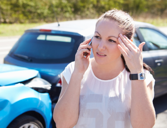 Woman on the phone after a Car Accident in Phenix City, AL